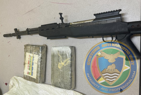 On July 19, 2024, CANU officers searched an unfinished building in Premniranjan Place, Prashad Nagar, and found a 7.62 assault rifle and two parcels containing suspected cocaine. The parcels, which tested positive for cocaine, weighed 2.3 kg. Two individuals are currently in custody, and investigations are ongoing.